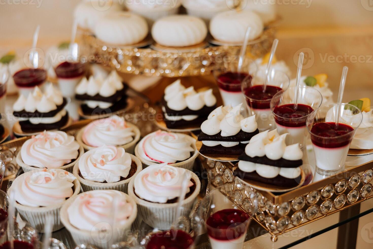 Almond cookies, sweet cakes for a wedding banquet. A delicious reception, a luxurious ceremony. Table with sweets and desserts. Delicious colorful French desserts on a plate or table. Candy bar. photo