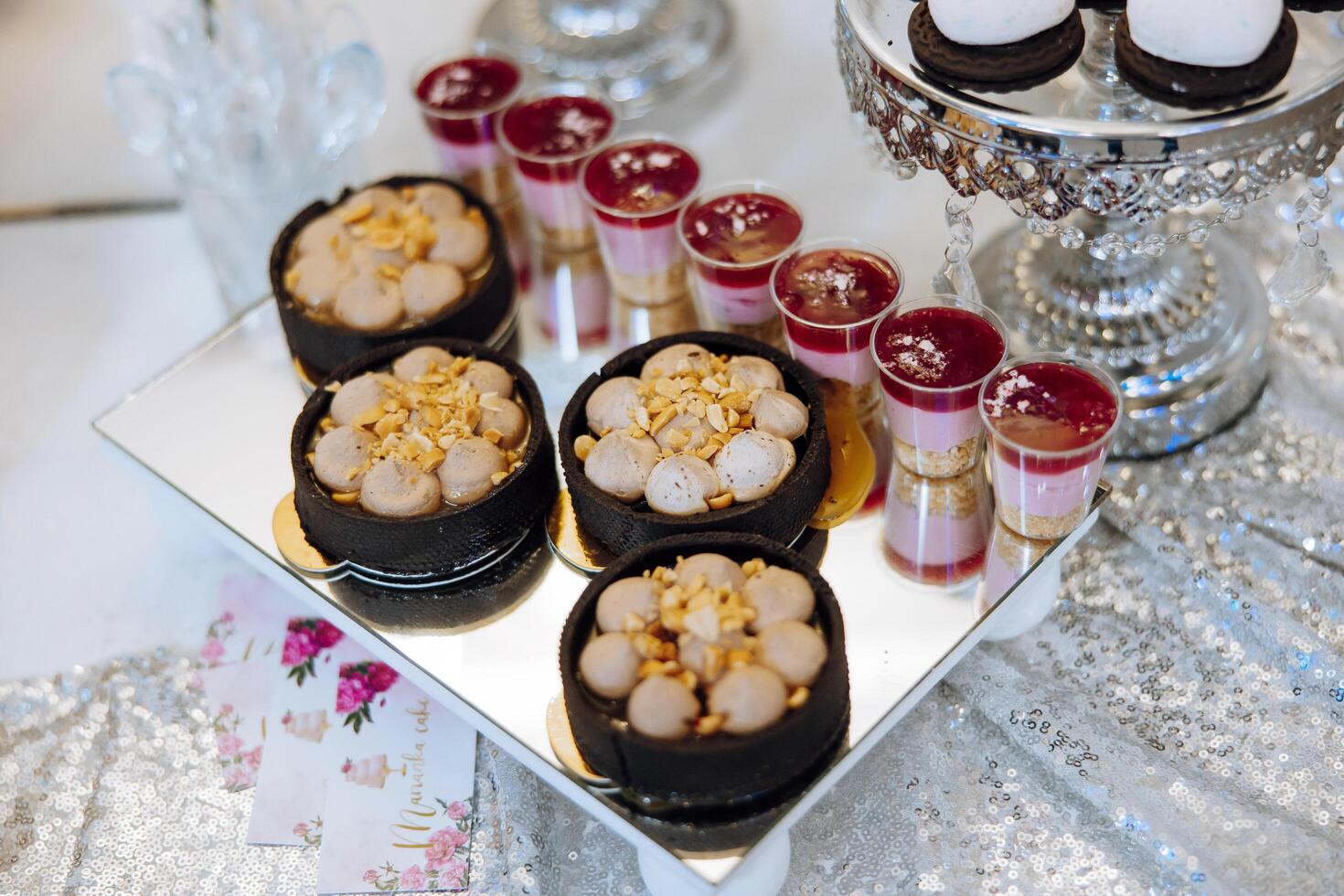 Almond cookies, sweet cakes for a wedding banquet. A delicious reception, a luxurious ceremony. Table with sweets and desserts. Delicious colorful French desserts on a plate or table. Candy bar. photo