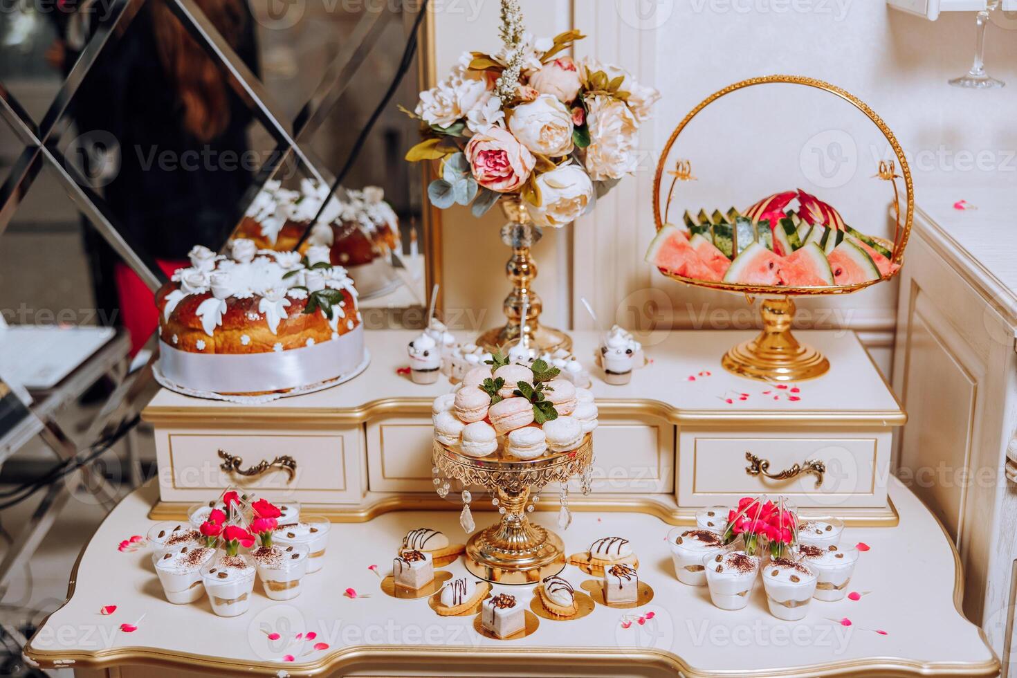 Almond cookies, sweet cakes for a wedding banquet. A delicious reception, a luxurious ceremony. Table with sweets and desserts. Delicious colorful French desserts on a plate or table. Candy bar. photo