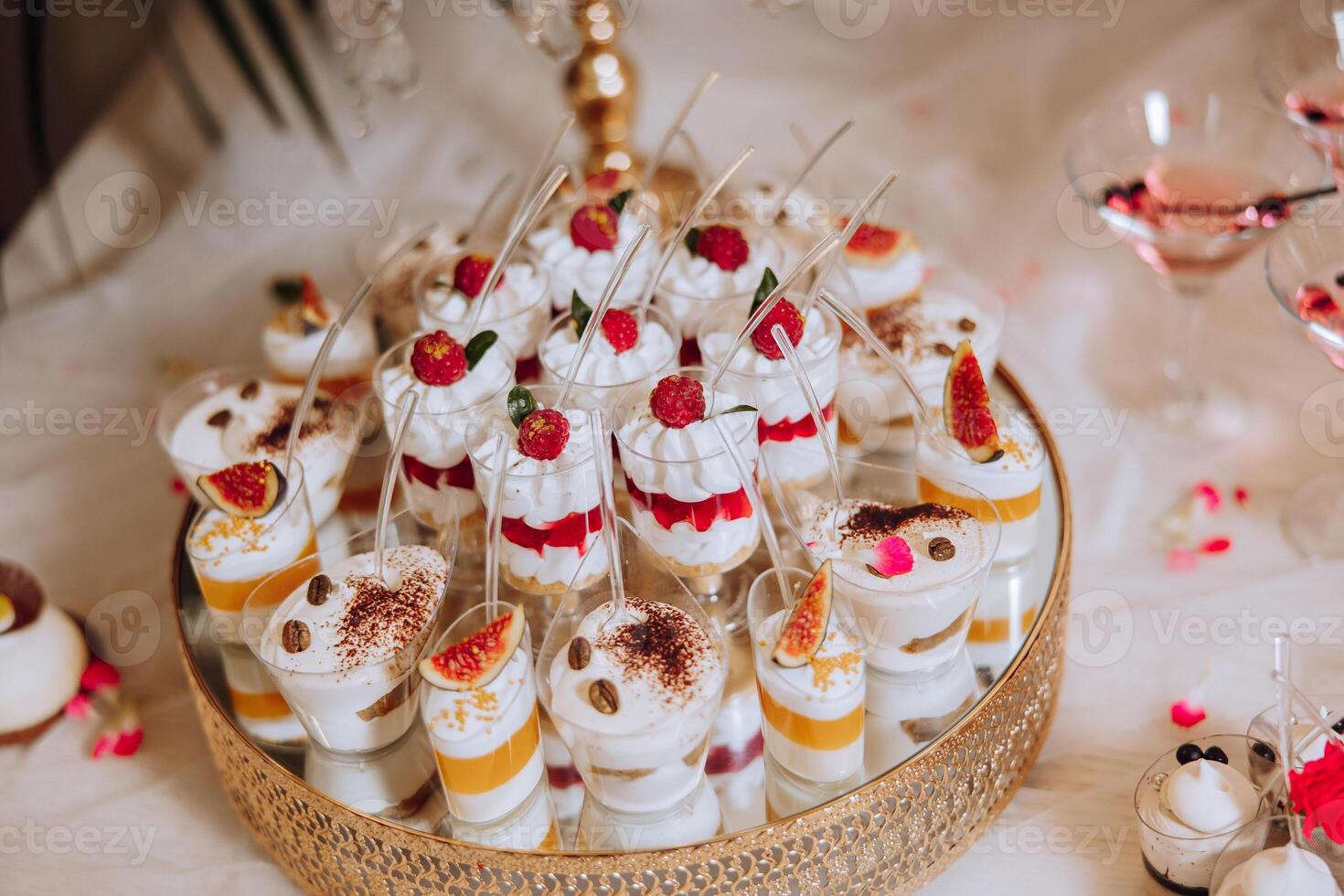 Almond cookies, sweet cakes for a wedding banquet. A delicious reception, a luxurious ceremony. Table with sweets and desserts. Delicious colorful French desserts on a plate or table. Candy bar. photo