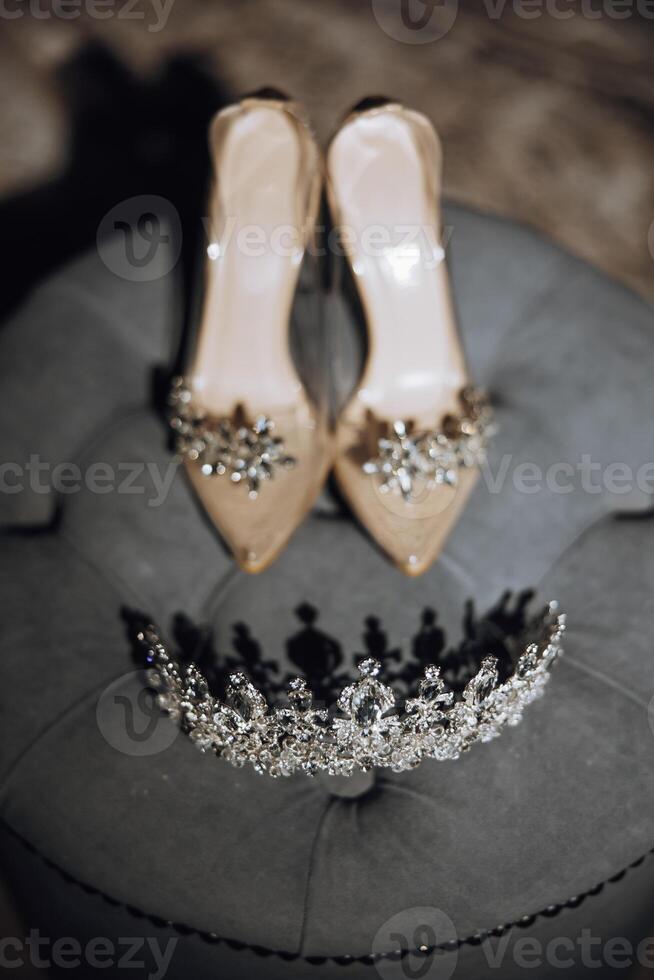 Miss Beauty Pageant Diamond Silver Crown, Crystal Tiara Jewellery, Embellished with Gemstones on Women's High Heel Shoes Background.. photo