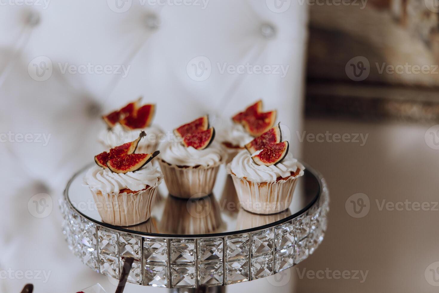 Almond cookies, sweet cakes for a wedding banquet. A delicious reception, a luxurious ceremony. Table with sweets and desserts. Delicious colorful French desserts on a plate or table. Candy bar. photo