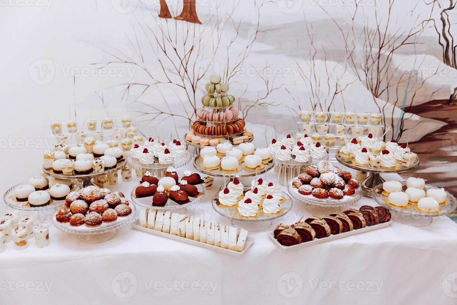 Almond cookies, sweet cakes for a wedding banquet. A delicious reception, a luxurious ceremony. Table with sweets and desserts. Delicious colorful French desserts on a plate or table. Candy bar. photo