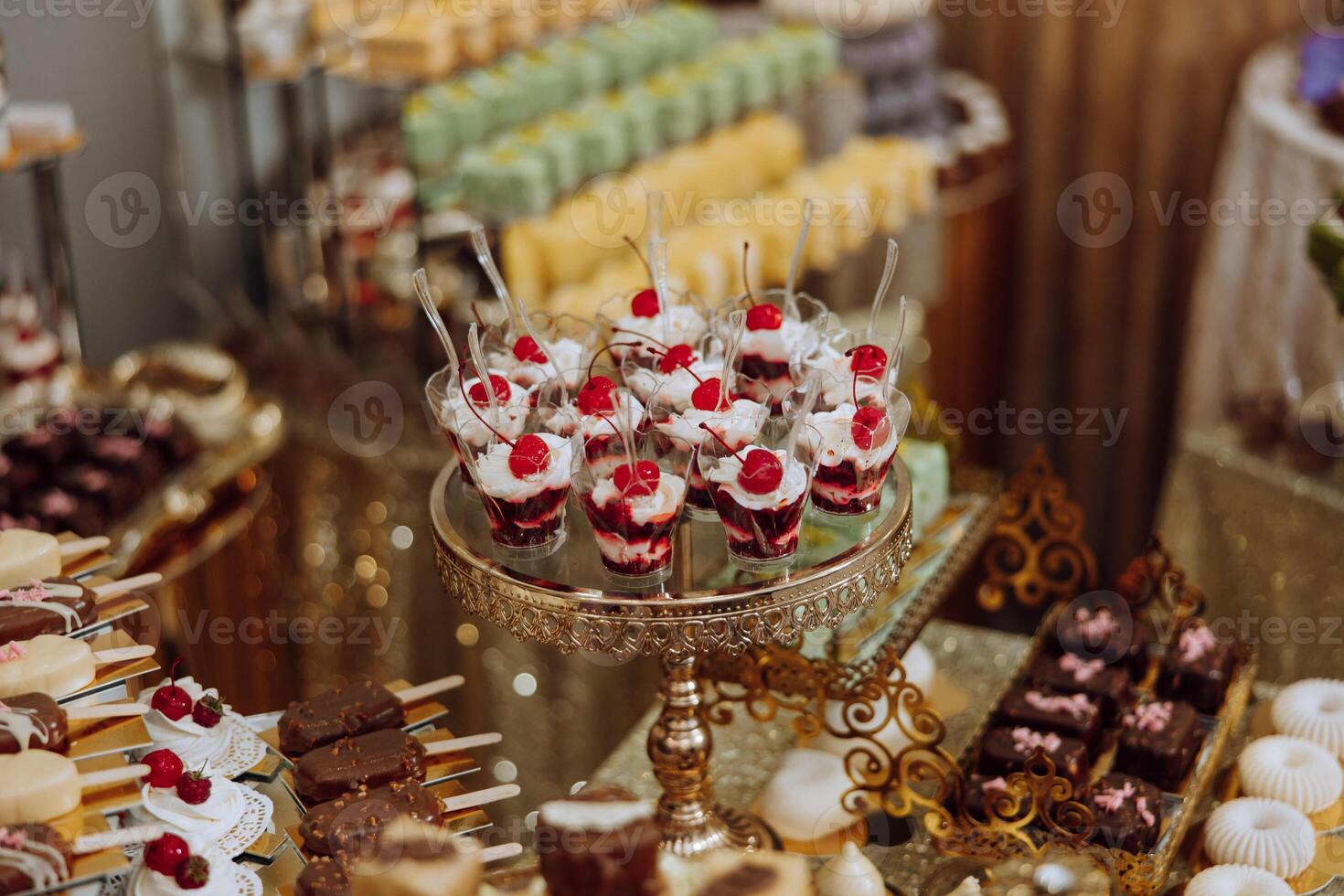 Almond cookies, sweet cakes for a wedding banquet. A delicious reception, a luxurious ceremony. Table with sweets and desserts. Delicious colorful French desserts on a plate or table. Candy bar. photo