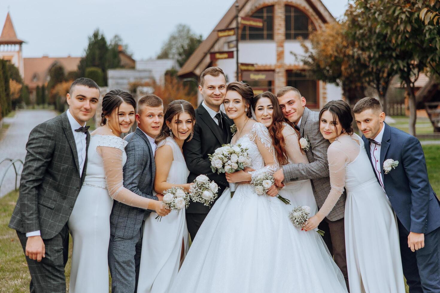 Wedding photo session in nature. The bride and groom and their friends