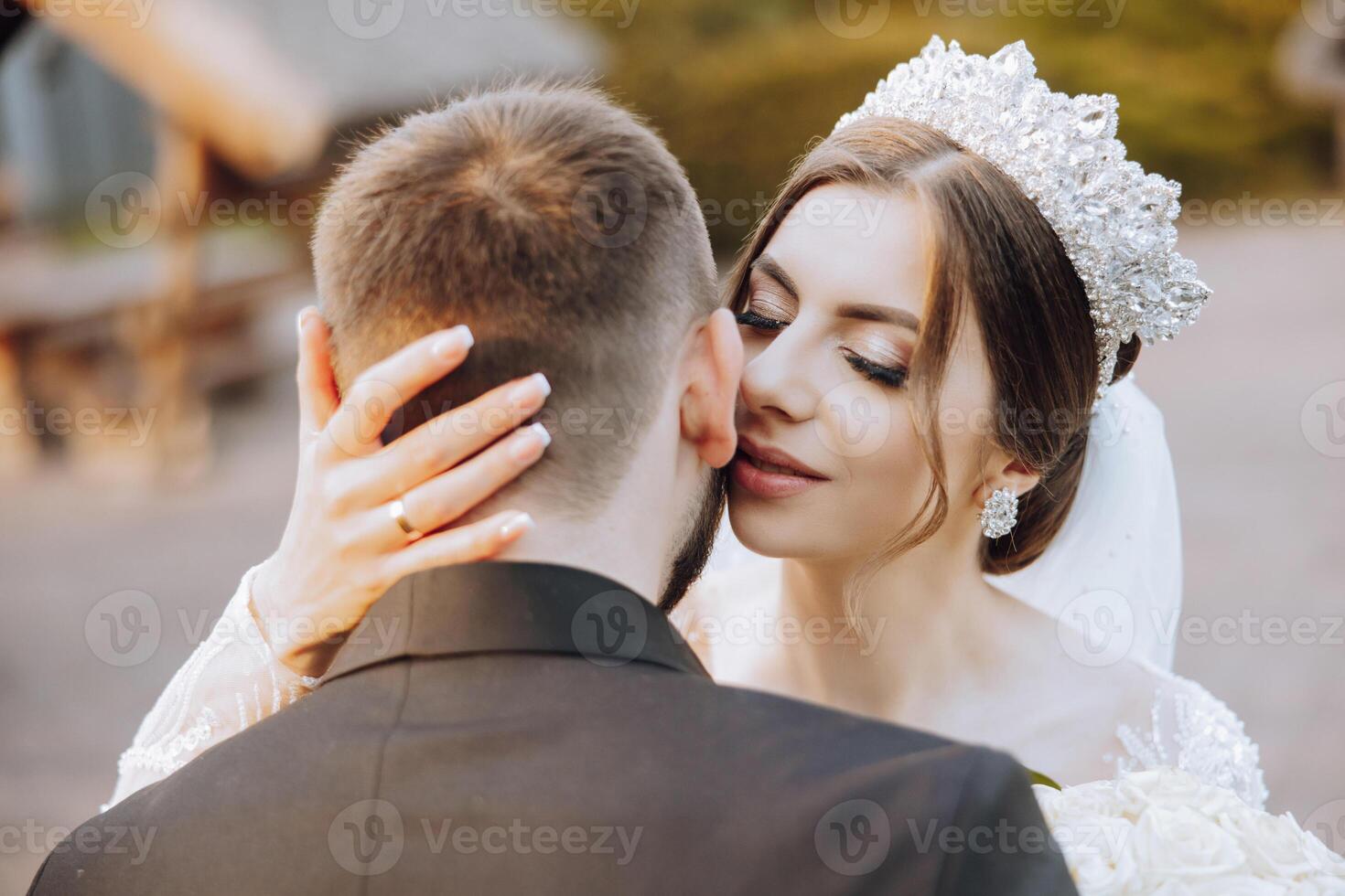 Wedding couple on a walk in the autumn park. The bride in a beautiful white dress. Love and relationship concept. Groom and bride in nature outdoors photo