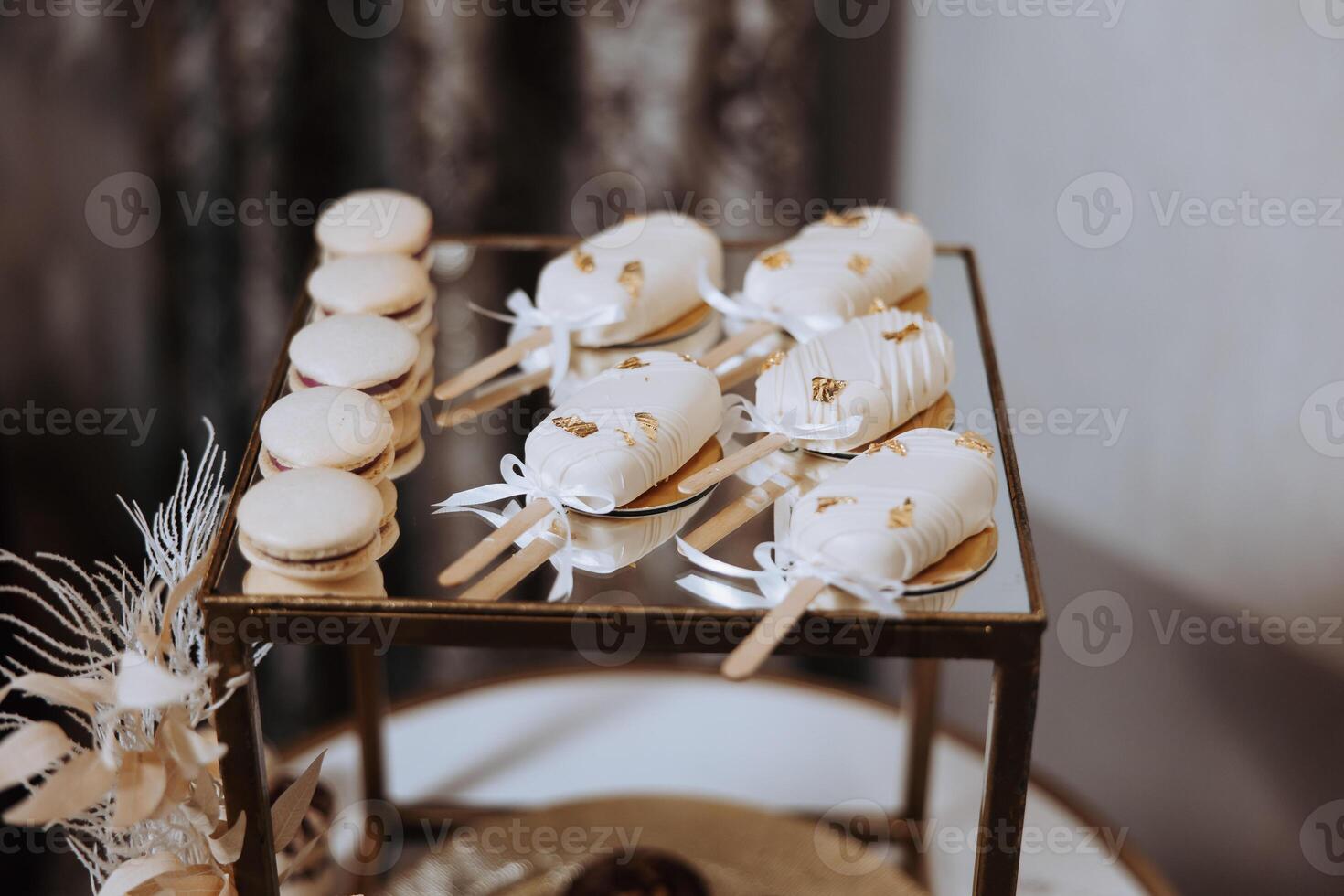 Almond cookies, sweet cakes for a wedding banquet. A delicious reception, a luxurious ceremony. Table with sweets and desserts. Delicious colorful French desserts on a plate or table. Candy bar. photo