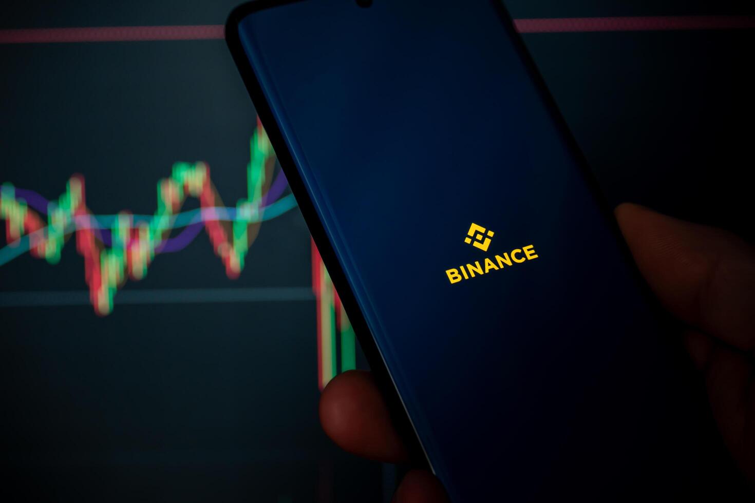 Cordoba Province, Argentina, March 11, 2024, Binance mobile application running on a phone. Cryptocurrency operations can be seen in the background. photo