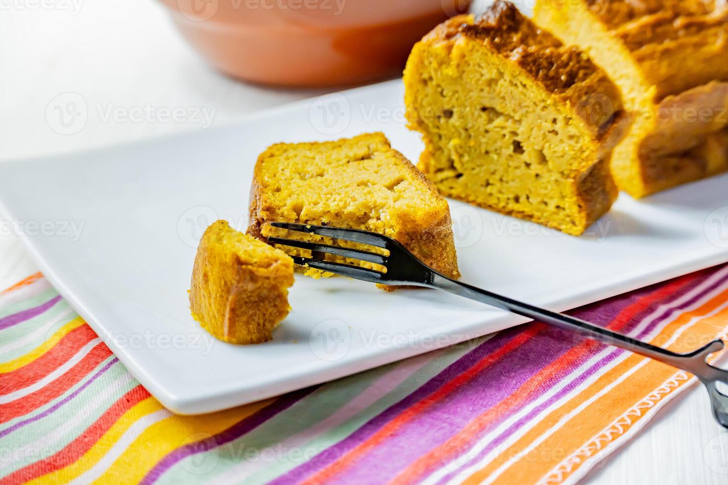 Piece of vegan carrot cake on a white tray. photo