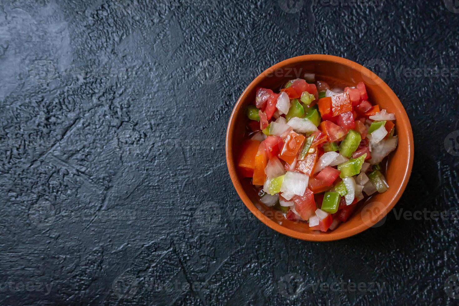 Typical Argentine Creole sauce. Made with bell peppers, tomato, onion, vinegar and oil. photo