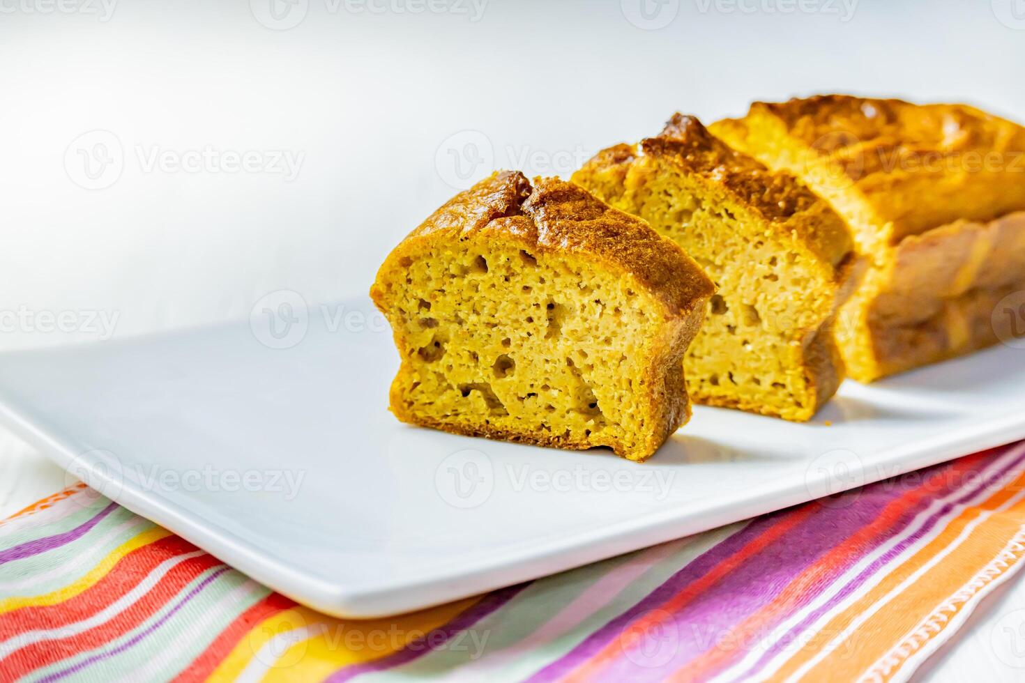 Carrot cake slices on a white tray. photo