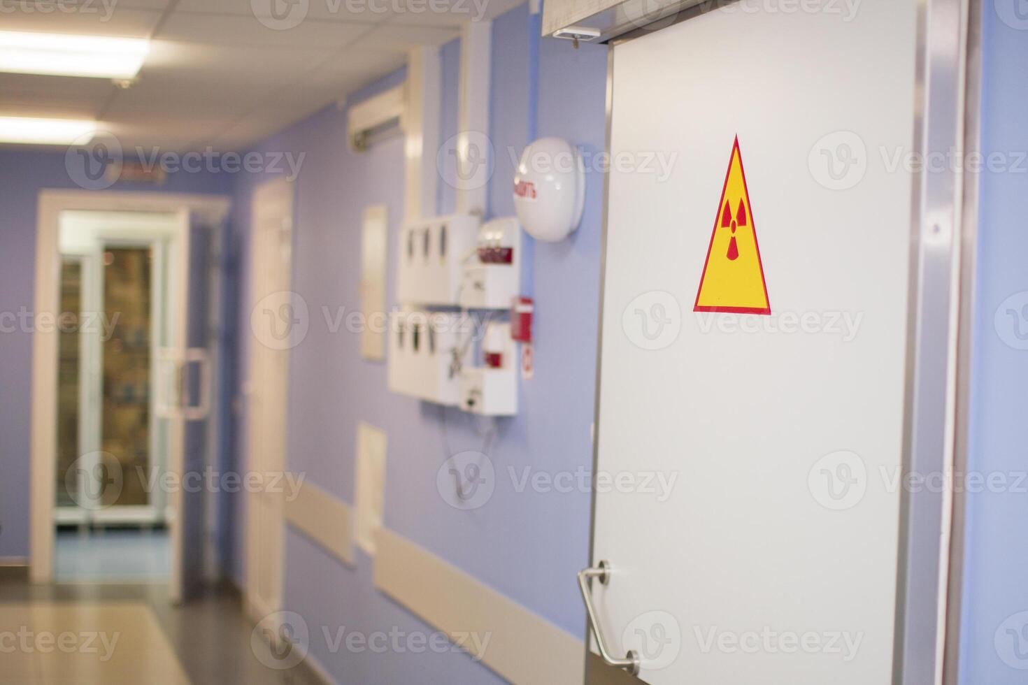 Radiological hospital corridor. Door with radiation sign photo