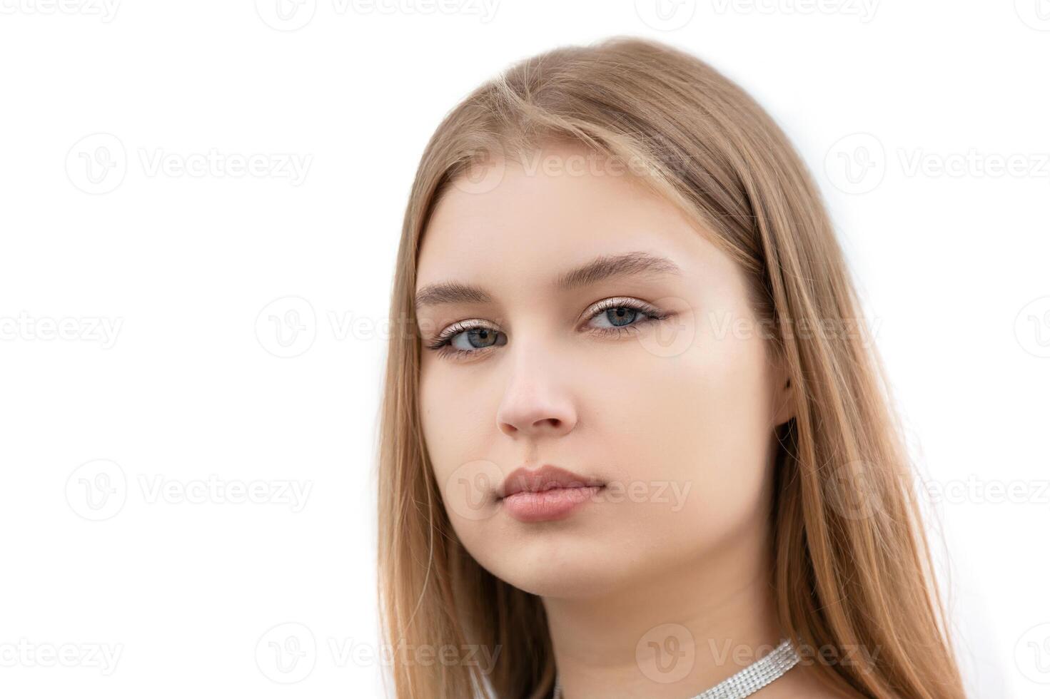 Portrait of a young girl of seventeen years of European type on a white background. photo