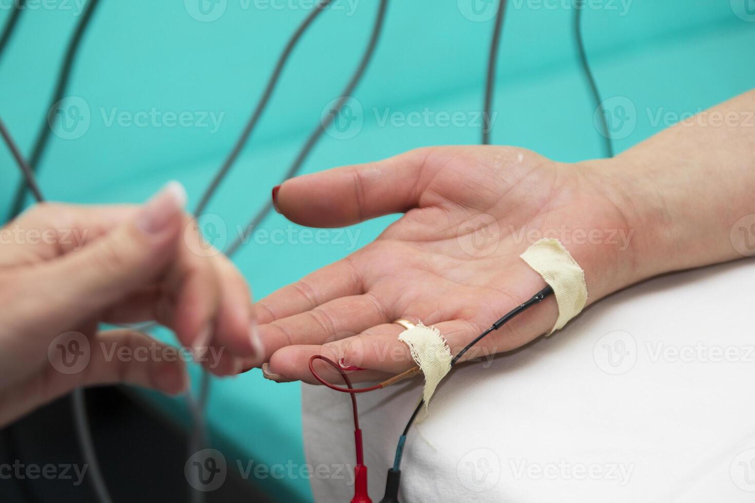 On the hands of the patient sensors. Diagnostics through electronic devices. photo