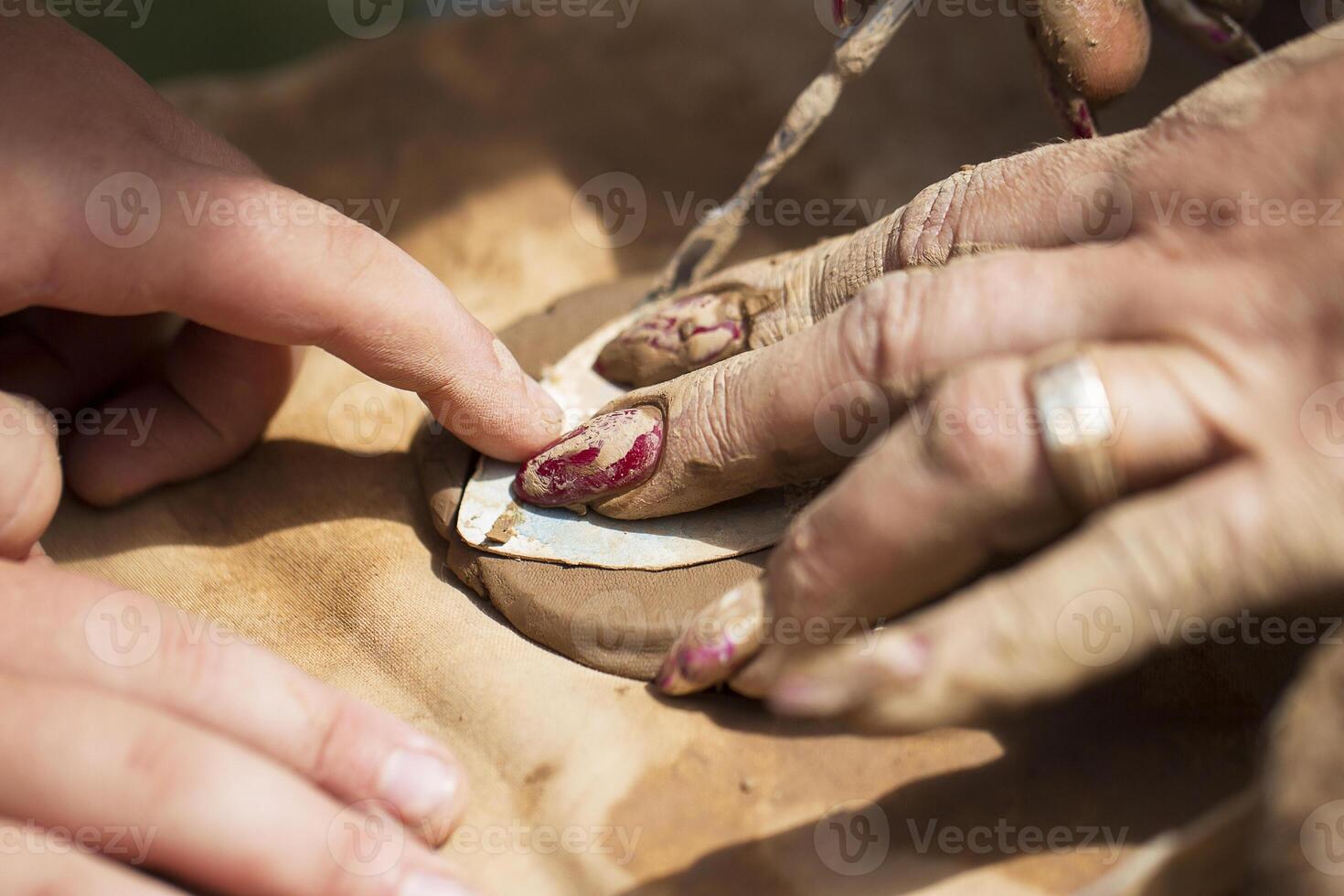 Hands make crafts from clay. Sculpt photo