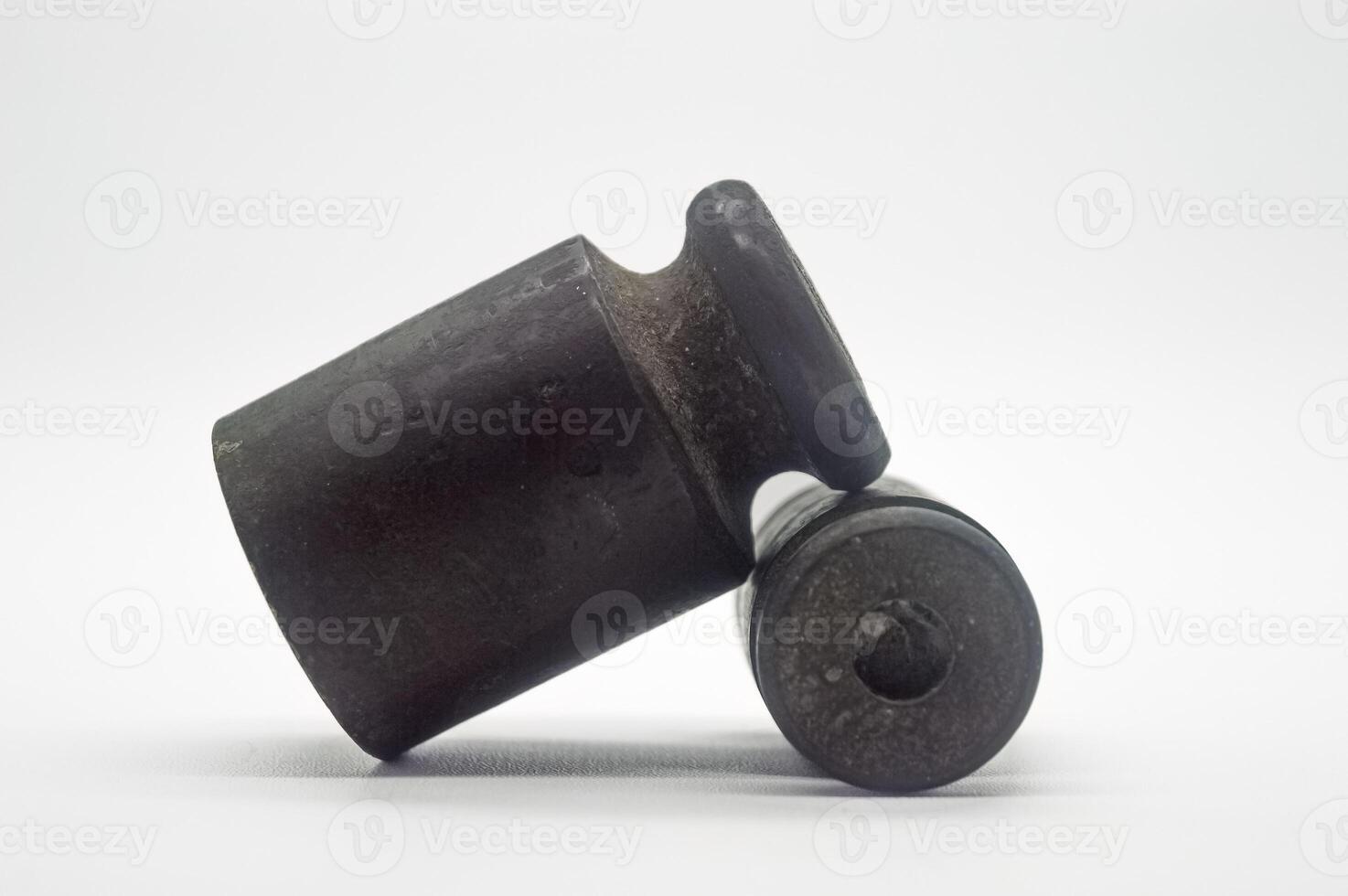 Old rusty iron scale weight isolated on white background. perfect for economics, finance and business articles photo