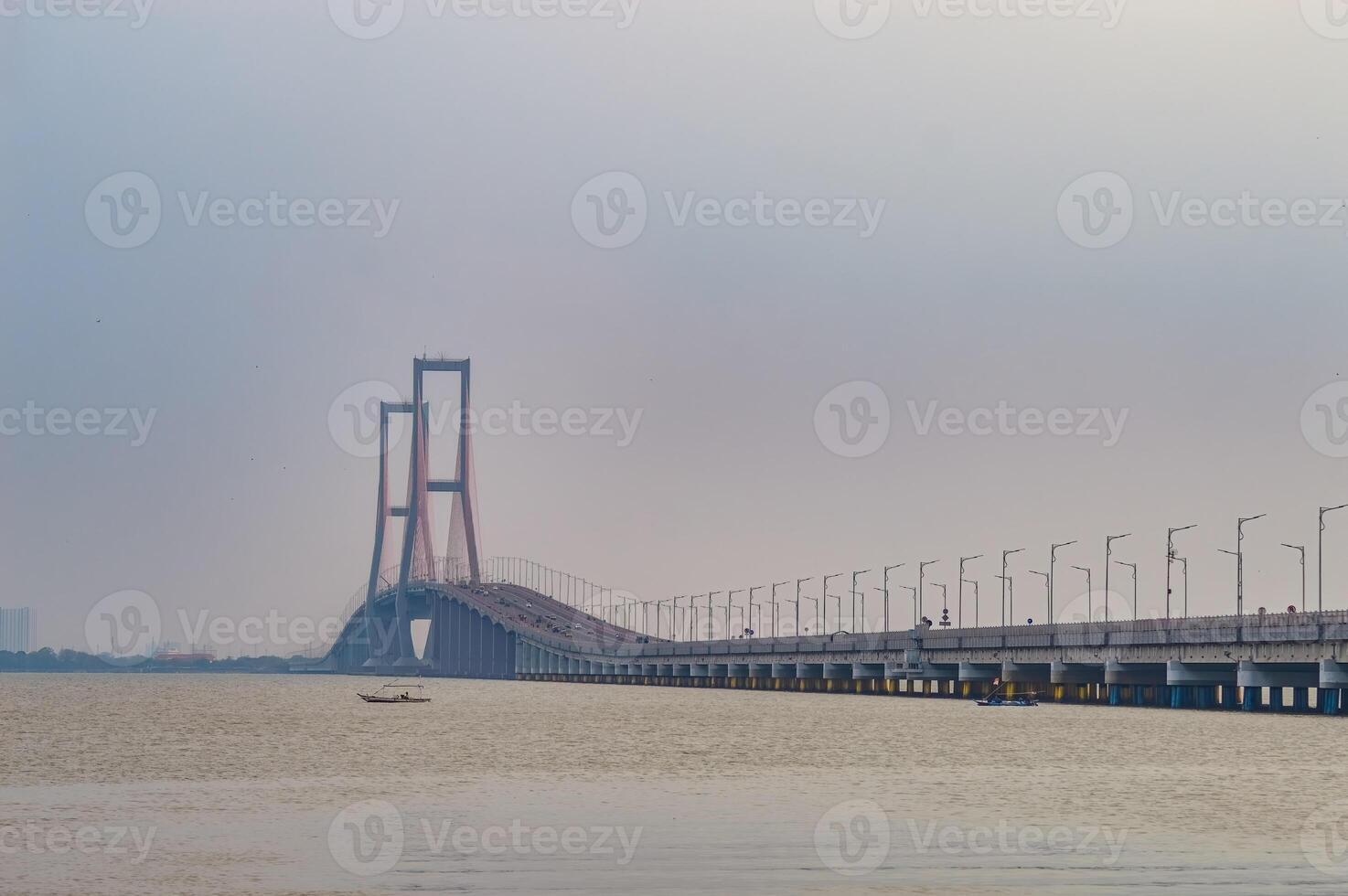 landscape of the Suramadu Bridge which stretches over the Madura Strait connecting the islands of Java and Madura Island photo