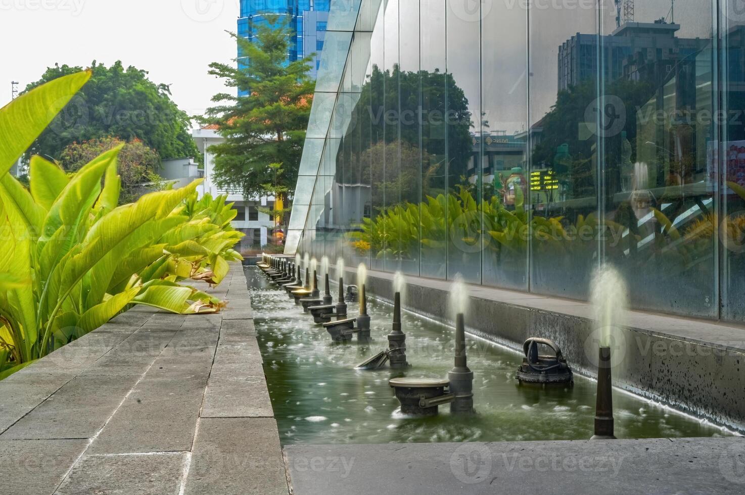 fountain pool in Surabaya city square park photo