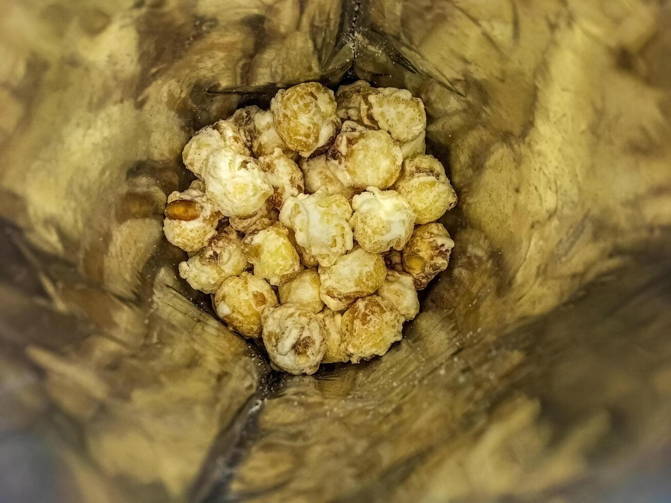 Cheese flavored popcorn in plastic packaging photo