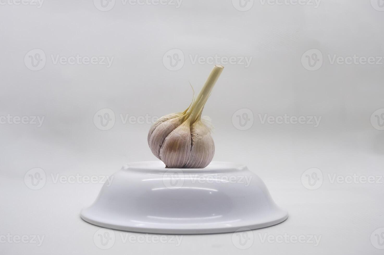 a garlic isolated on white backgrounda garlic isolated on white background photo