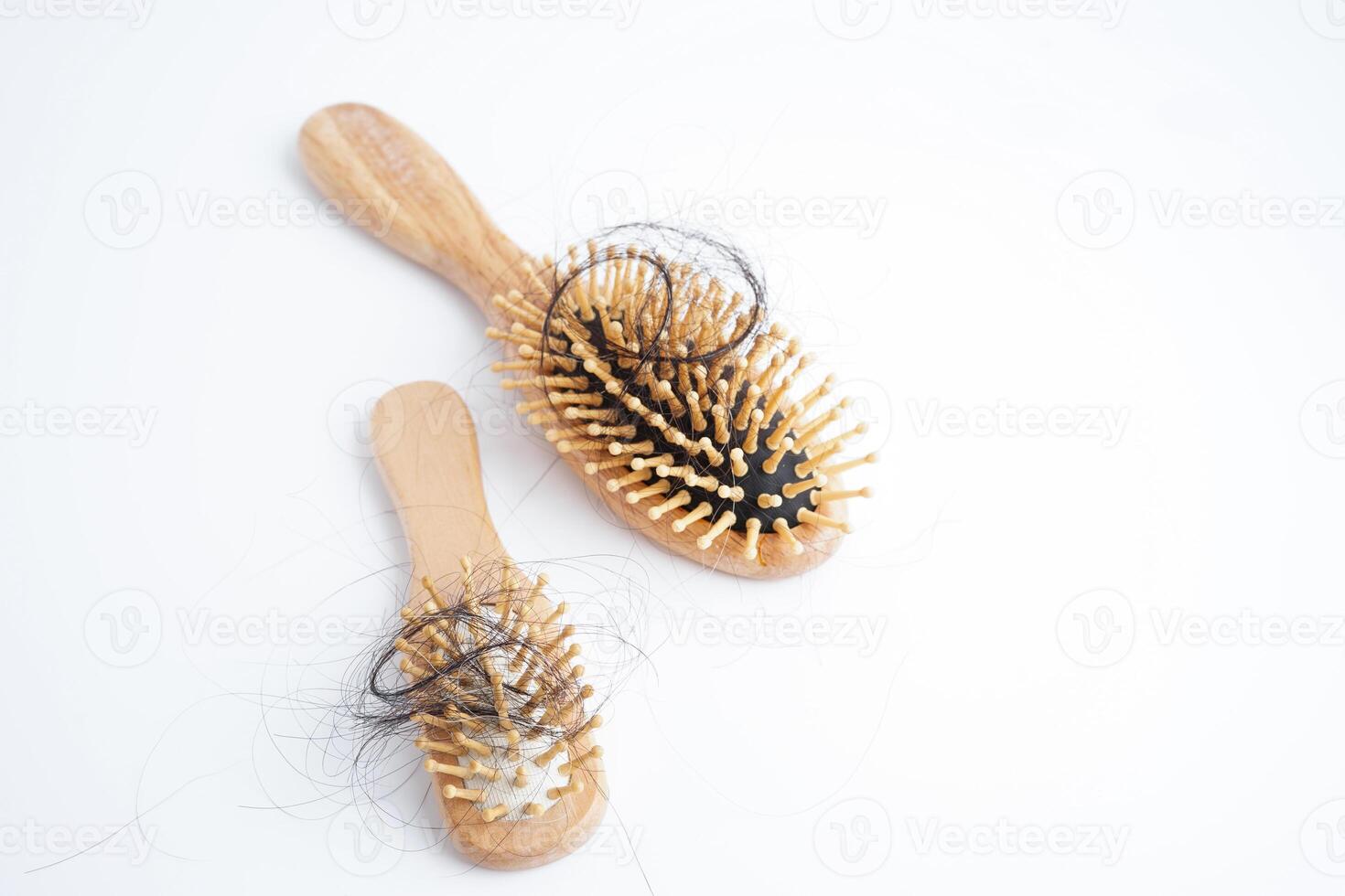 Hair loss fall with comb brush isolated on white background. photo