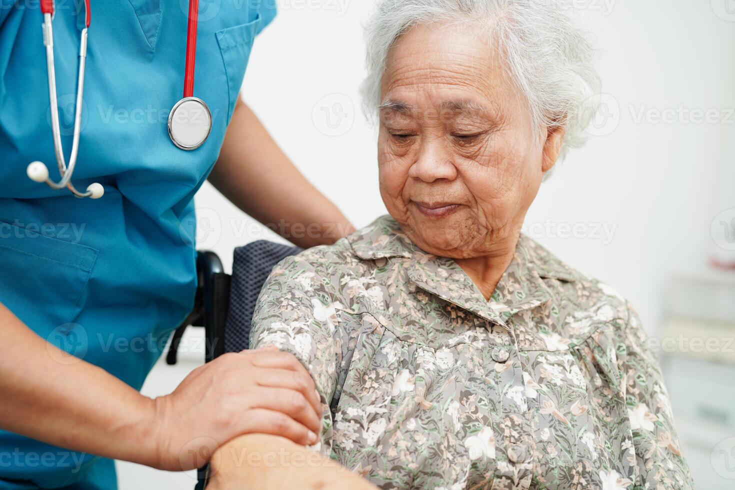 Doctor help Asian elderly woman disability patient sitting on wheelchair in hospital, medical concept. photo