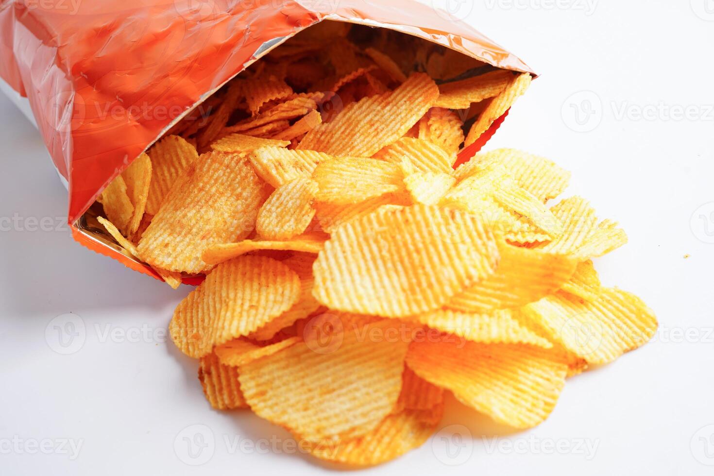 Potato chips in open bag, delicious BBQ seasoning spicy for crips, thin slice deep fried snack fast food. photo