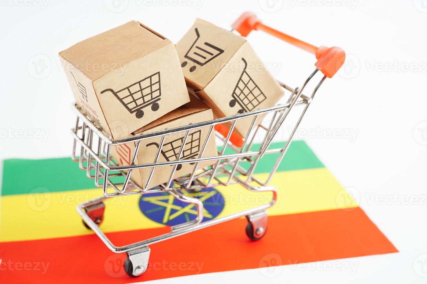 Online shopping, Shopping cart box on Ethiopia flag, import export, finance commerce. photo