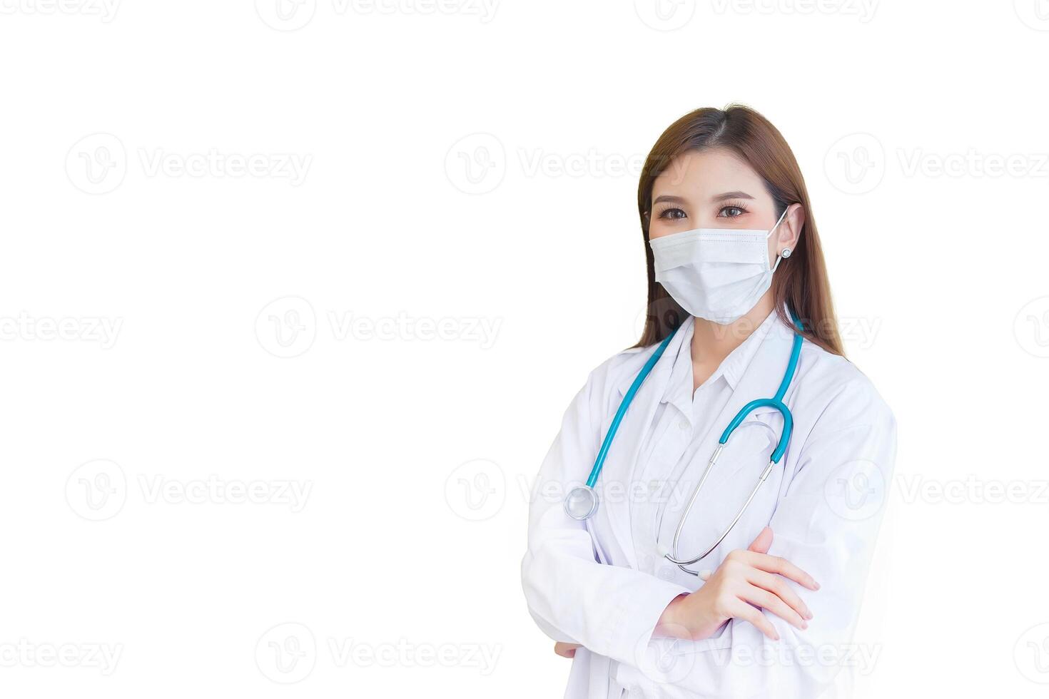 Professional Asian young woman doctor who she wear white lab coat as uniform wears medical face mask to protect virus while isolated white background. photo