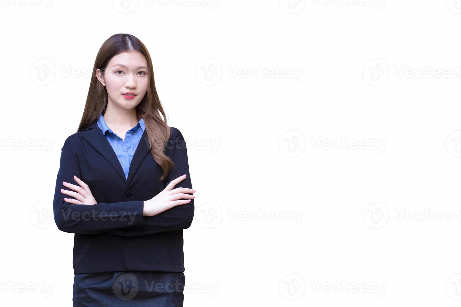 Young asian working woman who has long hair wears black formal suit with blue shirt while she arm crossing confidently while isolated white background. photo