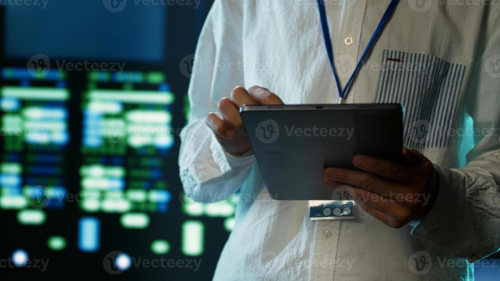 Certified technician strolling through server rows providing processing resources for different workloads. Adept expert monitoring supercomputers tasked with solving complex operations, close up photo