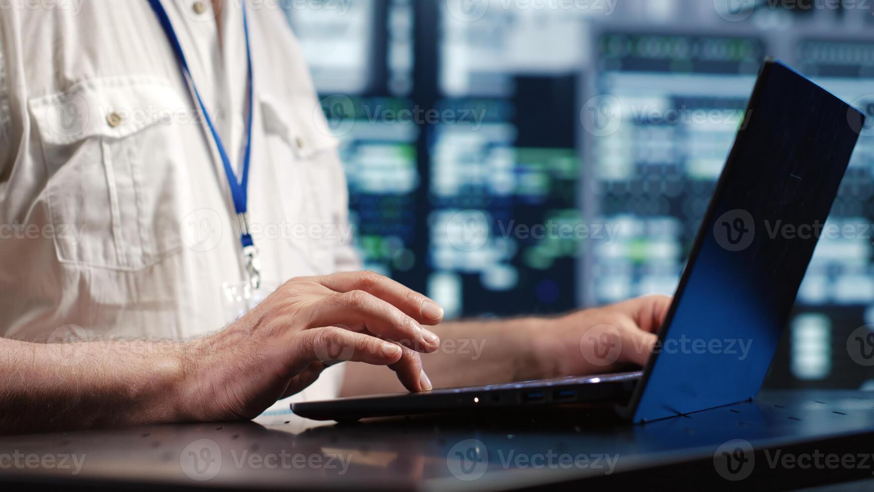 Certified IT admin expertly managing data while navigating in industrial server room. Trained computer operator ensuring optimal cybersecurity protection, optimizing systems, close up photo