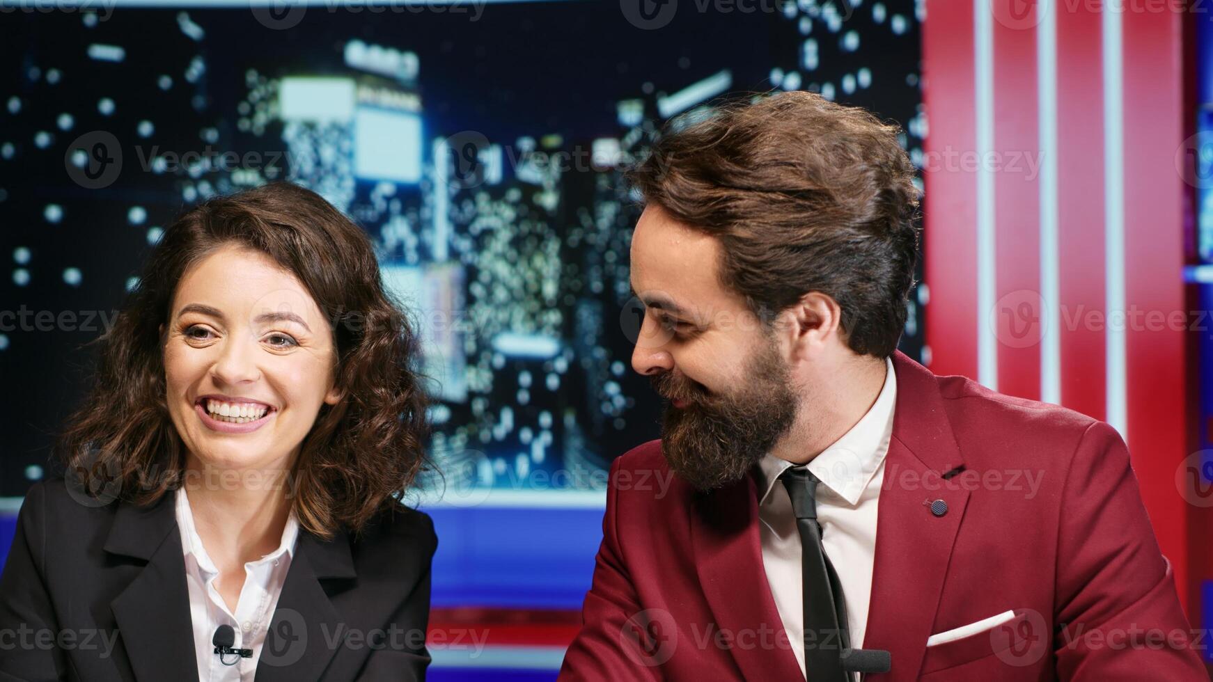 Midnight show hosts covers latest news, going live on international television program and presenting daily events. Media reporters hosting entertainment segment on late night talk show. photo