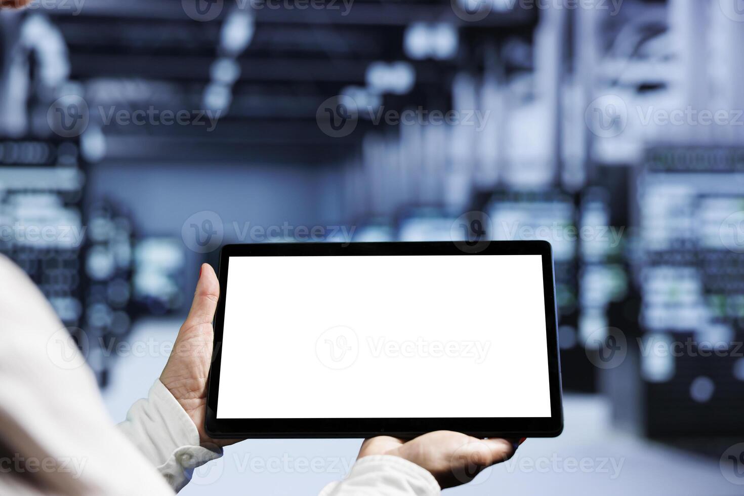 Close up shot of mock up tablet used by professional in server room delivering massive computing power, capable of processing and storing vast amounts of data and controlling network resources photo