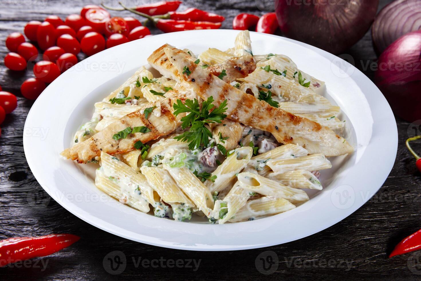 Pasta with roasted chicken steak photo