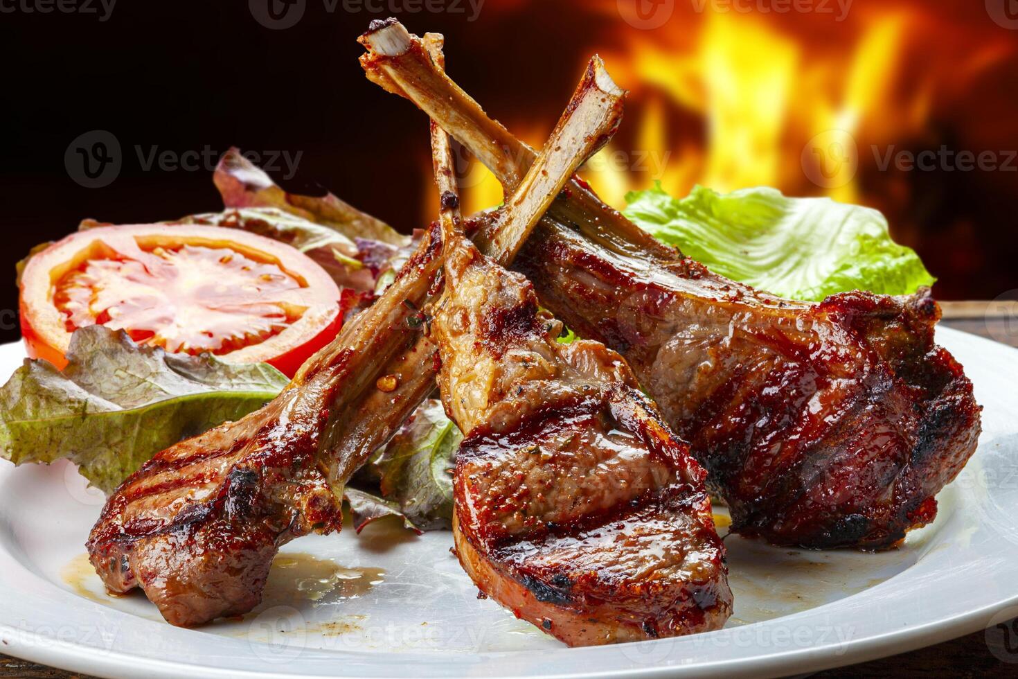 rack of lamb with lettuce and tomato photo