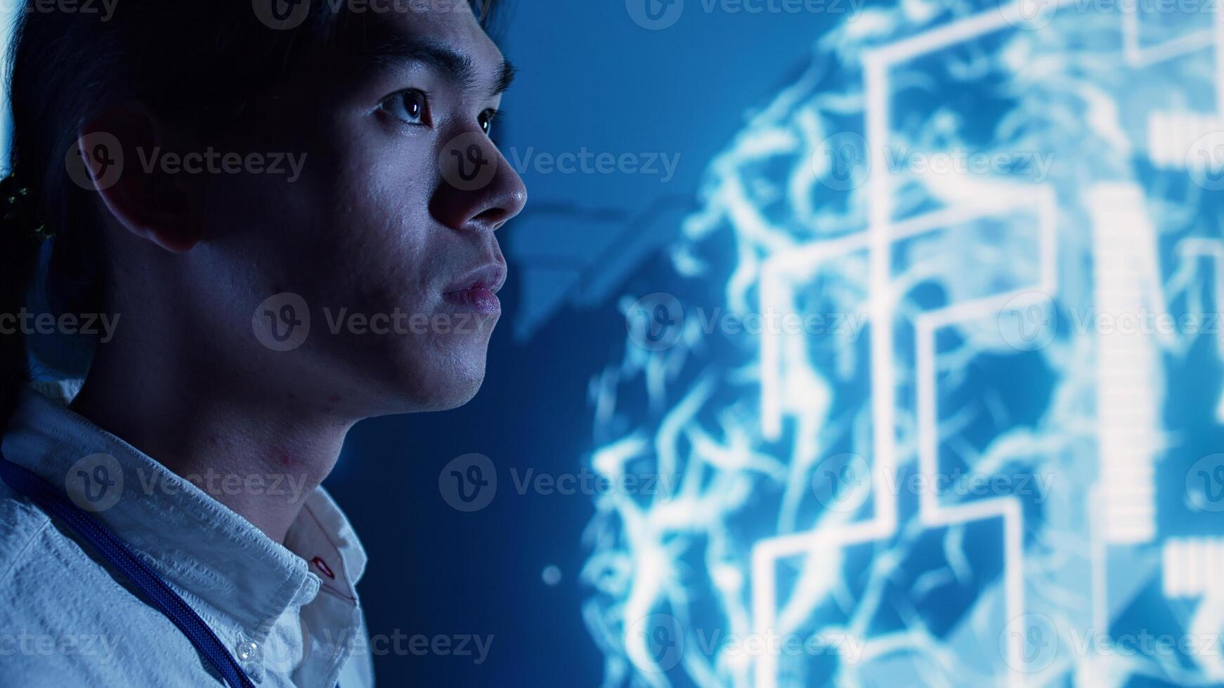 Close up of admin looking at hologram of artificial intelligence cognitive computing human brain simulation. Adept technician interacting with AR AI visualization showing machine learning algorithms photo