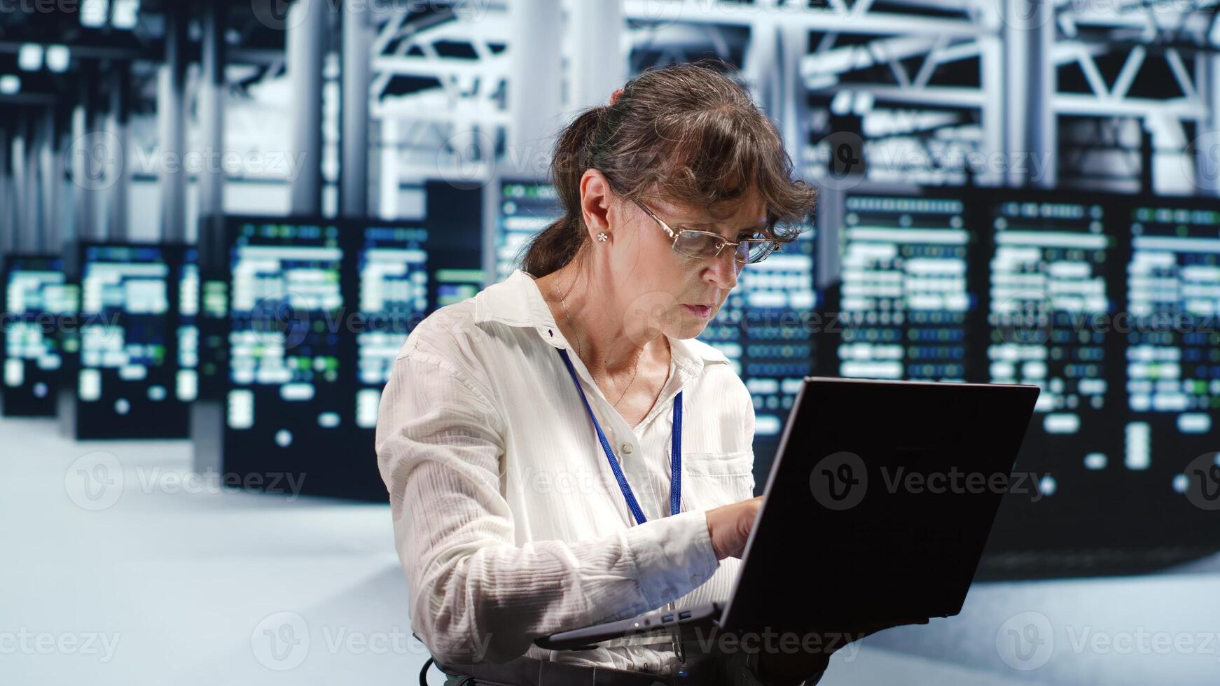 Proficient system administrator looking around revolutionary data center, preparing to start comission on damaged high tech server rackmounts in order to ensure ideal operations photo