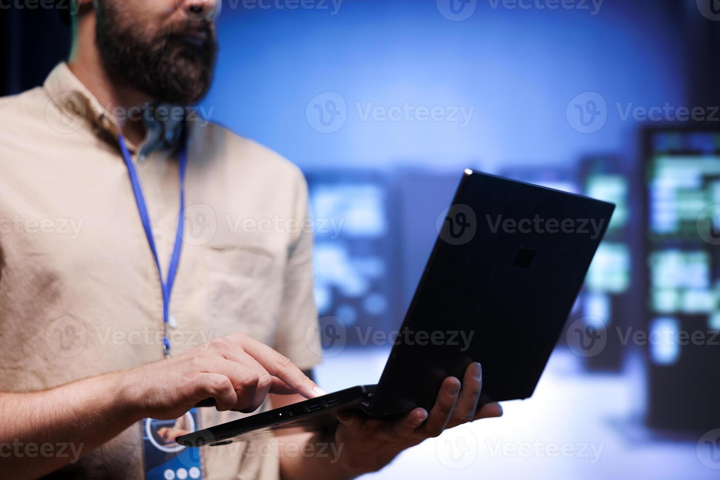 Technical support worker ensuring data center servers are properly equipped to provide redundancy, automatic failover and rapid reconfiguration of clusters to minimize failure of individual machines photo