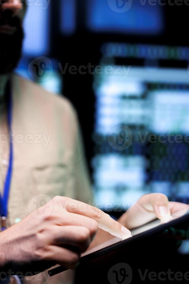 Precise engineer in high tech facility repairing network issues affecting server racks performance and connectivity, resulting in slow data transfer rates and poor client communication, close up photo