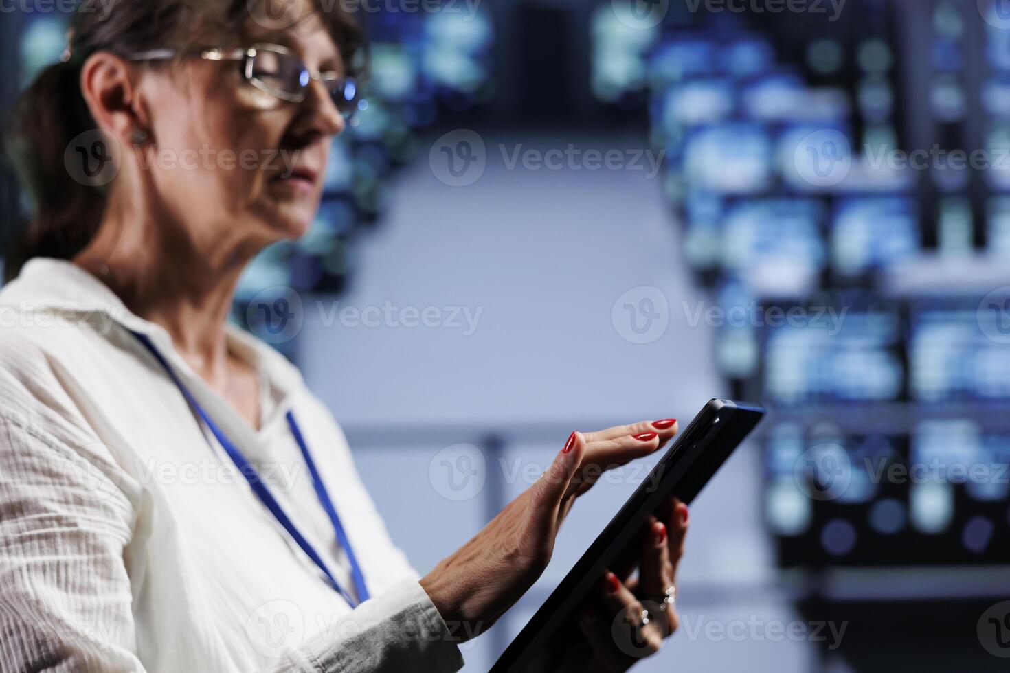 Knowledgeable professional preparing cloud computing service contingency plan, monitoring data center energy consumption across components, making sure sensors are in sound condition photo