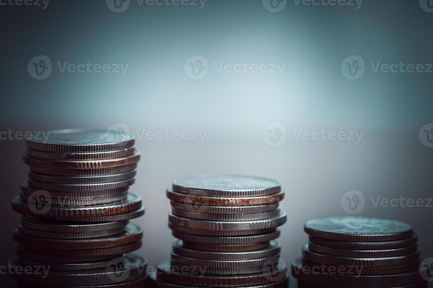 Stack of coins with filter effect retro vintage style and shallow depth of field photo