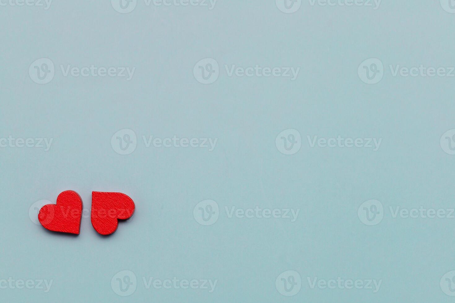 Red hearts on a blue background. Valentine's Day. Copy space. photo