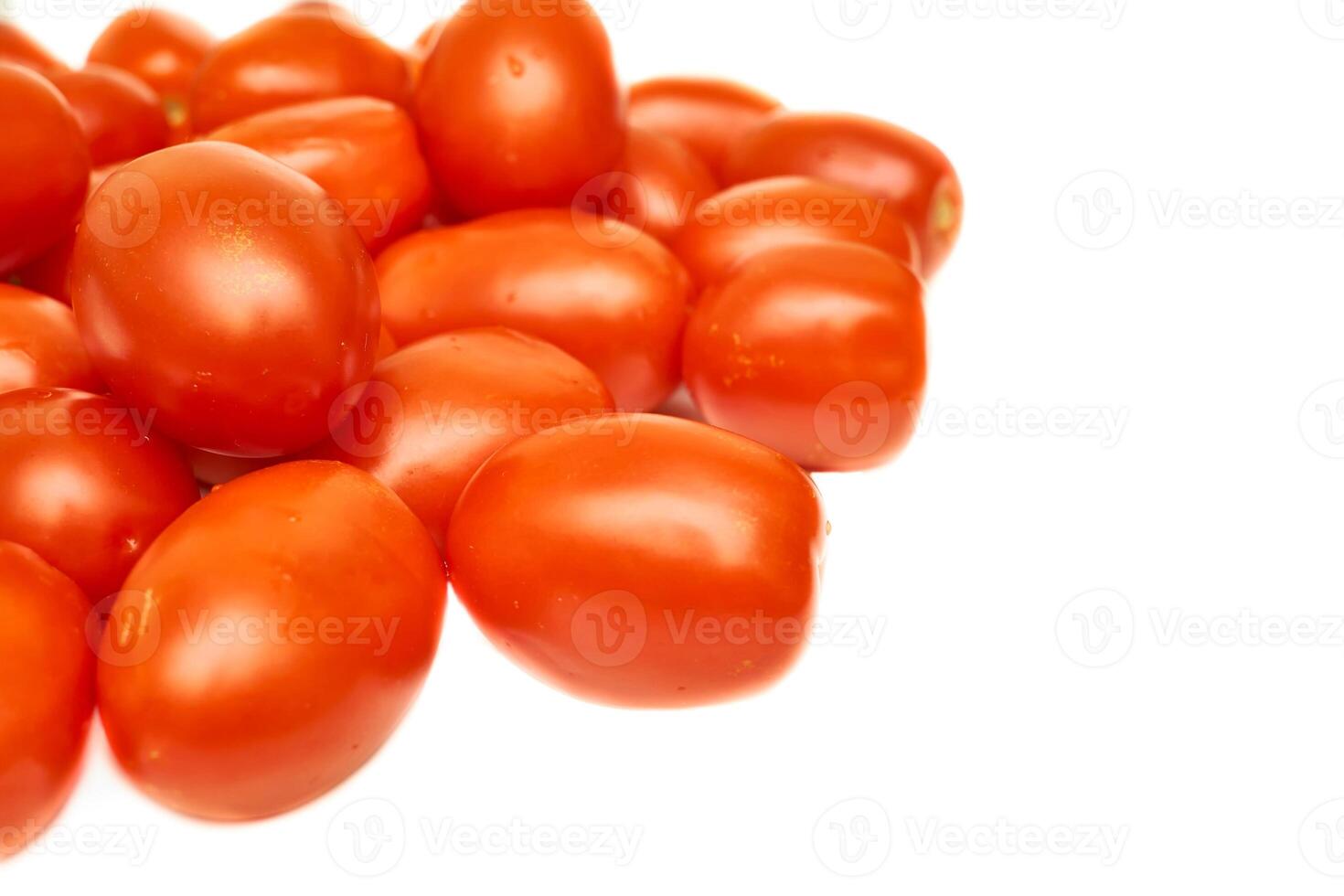 Pile of ripe red delicious tomatoes for cooking on white photo