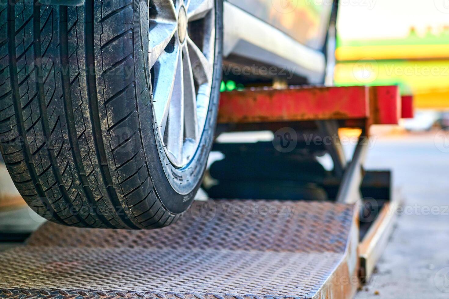 Replacing and repairing a car wheel at a tire station photo