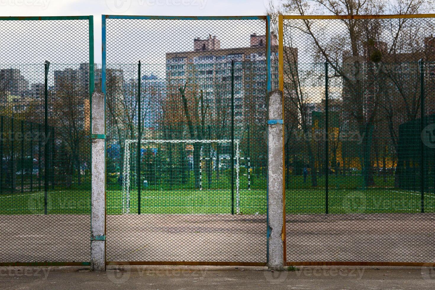 Sports ground behind the net in the middle of the city photo