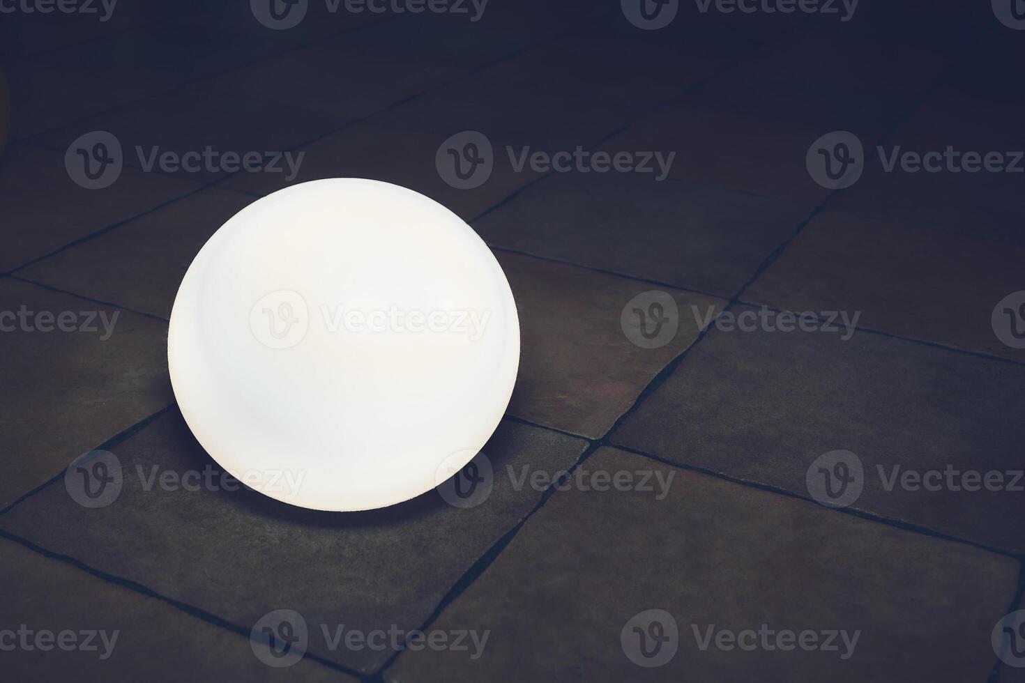 Magic glowing white ball on stone tile floor. High quality photo