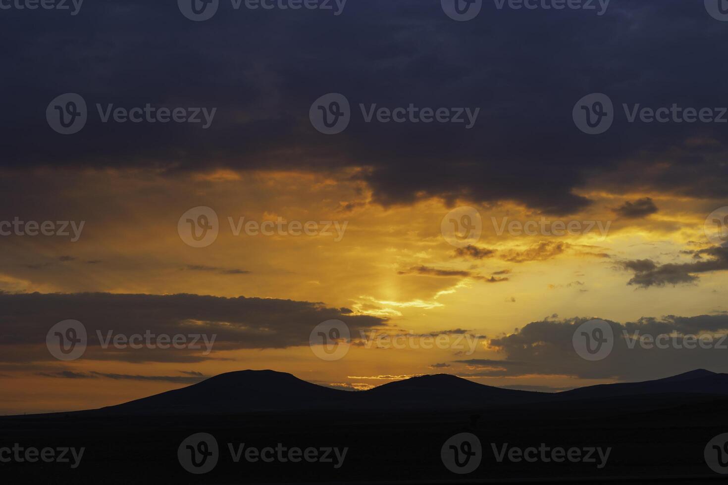 Inspirational quotes concept photo. Silhouette of hills at sunset or sunrise photo