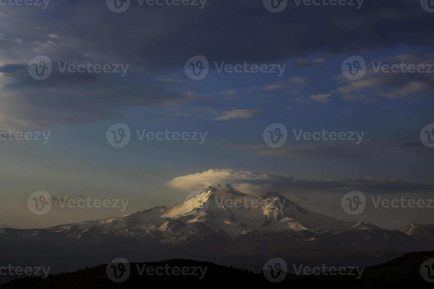 Mountain in the morning with clouds and snowy hills. Mount Erciyes in Kayseri photo