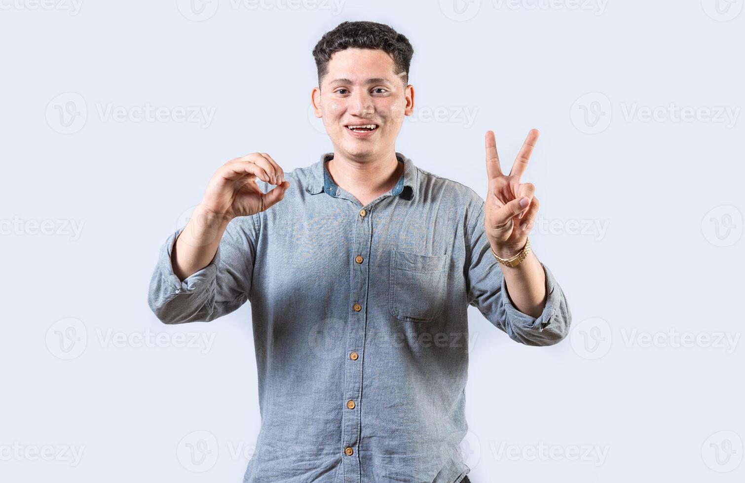 Interpreter man gesturing LOVE AND PEACE in sign language isolated. Smiling person making gesture LOVE AND PEACE in sign language photo